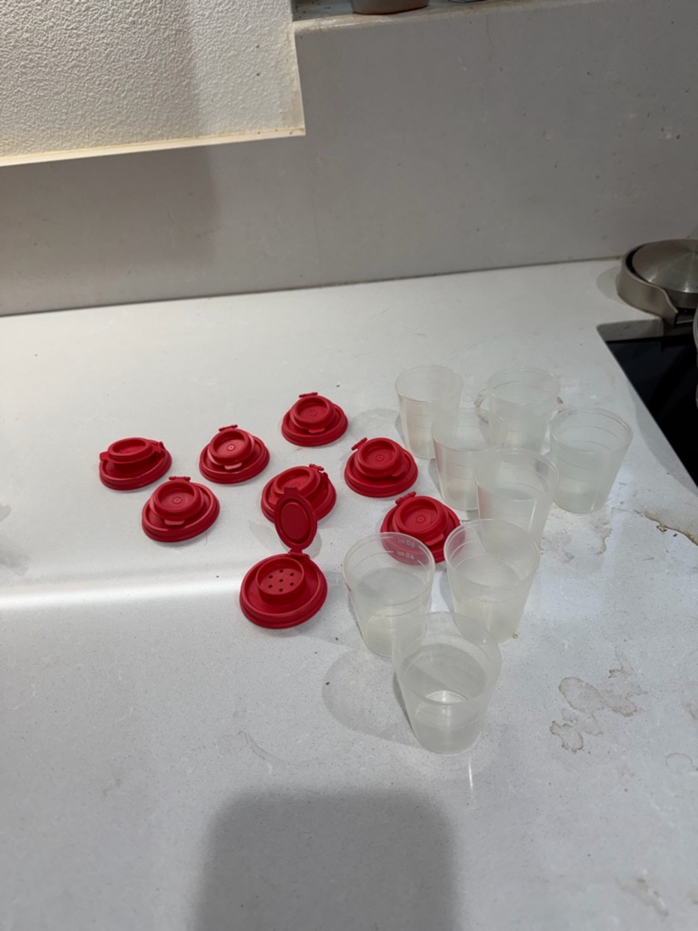 Tupperware vintage salt/pepper shakers. Lot of 8! New. Red top, clear cup.
